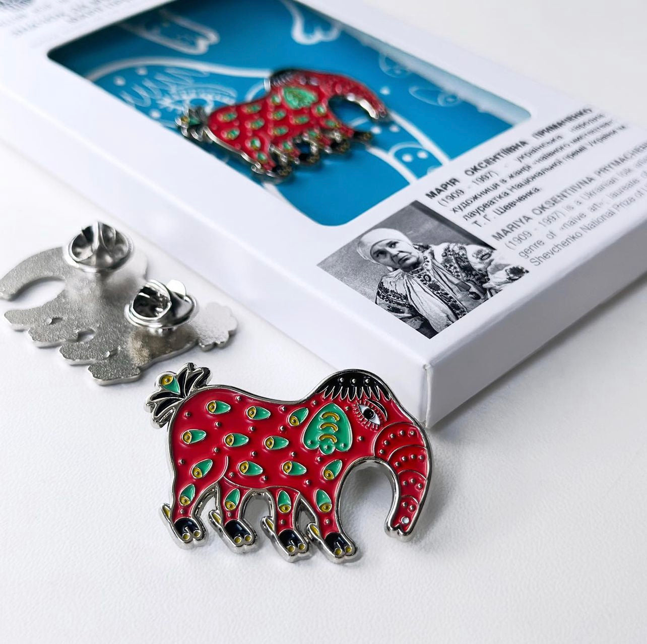 Metal badge "The elephant wanted to become a sailor" from Yellow_Blue_UA based on the paintings of Maria Prymachenko